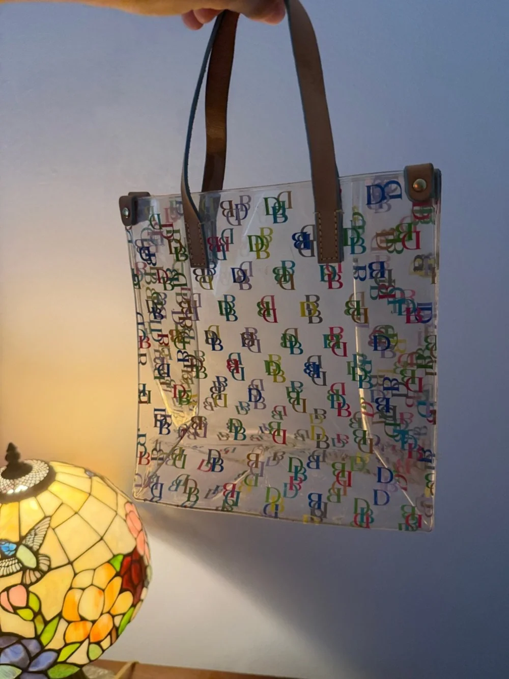 Dooney & Bourke Clear Tote with Multicolor DB Logos and Brown Handles